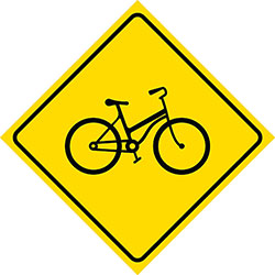 diamond-shaped yellow sign with image of bicycle