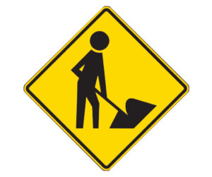 Diamond-shaped yellow sign showing silhouetted figure digging