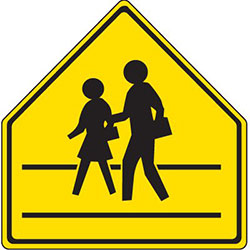 yellow pentagonal sign with image of two people crossing street.